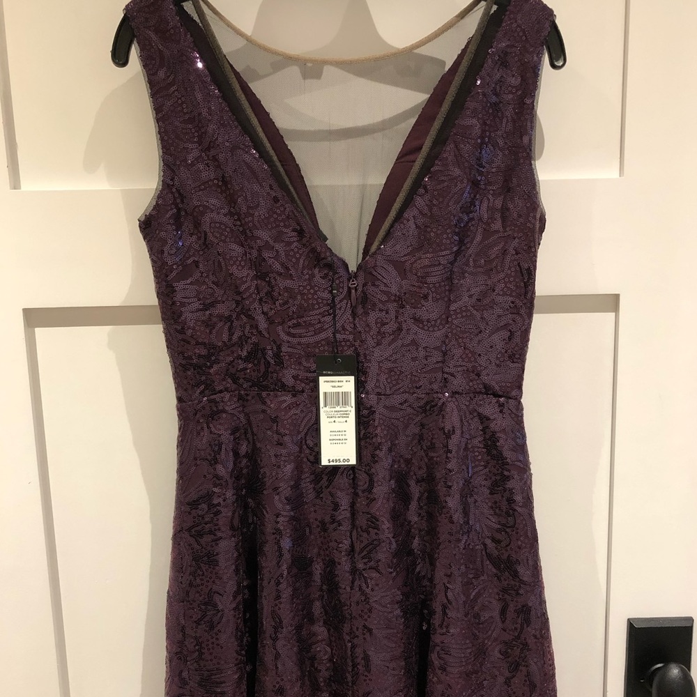 Gorgeous deep purple sequin mini dress. Never worn. Still has tags.